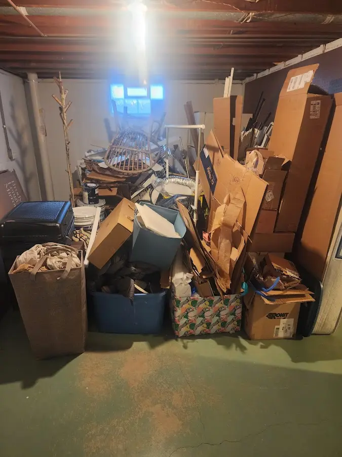 Roll-off dumpster container at job site for 2 Yard Dumpster Rental in Raymond